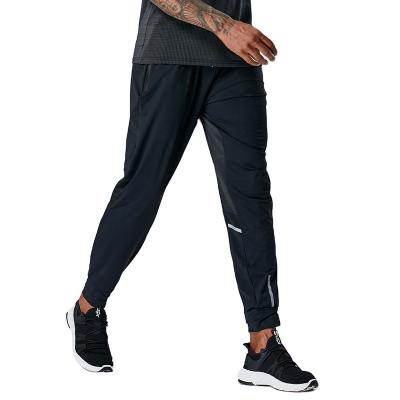 China Autumn elastic spring Anti-wrinkle basketball sports loose casual fitness running pure color quick-drying custom made men's pants for sale