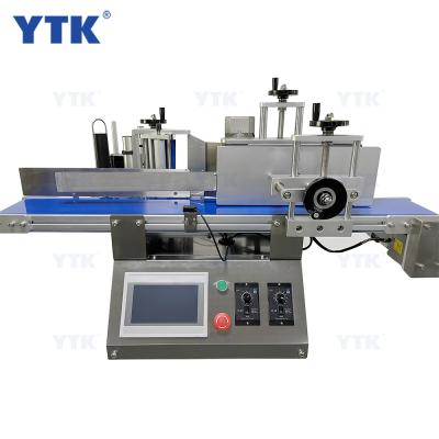 China YTK food brand good quality table top round bottle automatic sticker labeling machine with conveyor for sale