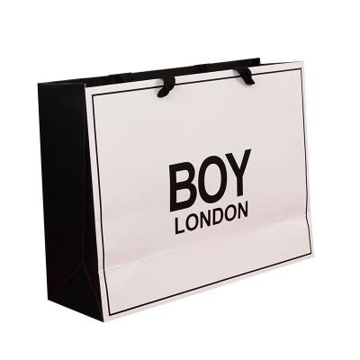 China Recycled Materials Cheap Wholesale Price Famous Brand Luxury Gift Custom Printed Shopping Paper Bag With Your Own Logo Te koop