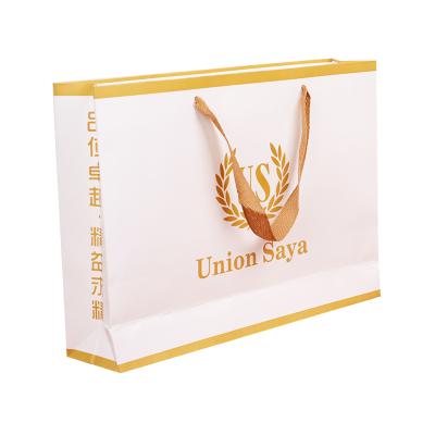 中国 Recycled Recyclable Materials Kraft Paper Bag With Twisted Handle Reusable Shopping Paper Bags Logo Printed 販売のため