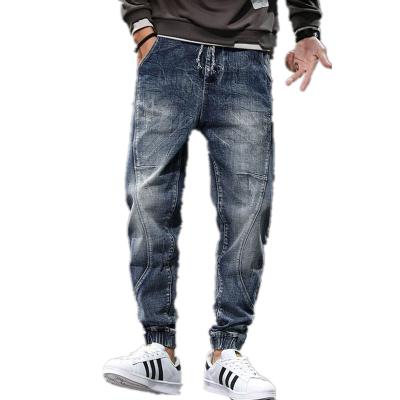 China Fashion trend waistband drawstring pants breathable hot selling elastic jeans plus size washed blue men's jeans for sale