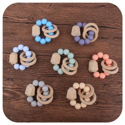 China 15MM Silicone Wooden Ring Rattle Teether Newborn Infant Natural Eco-friendly Handmade Baby Teething Toy for sale