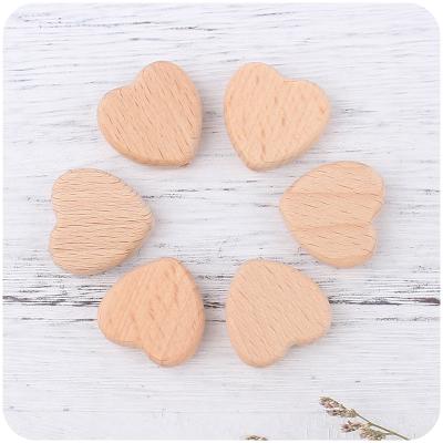 China Love Pendant Safe Beech Wood Heart Shaped Teether Beads Nurturing Pendant Charm Accessories for sale