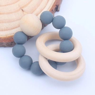 China Softwood Teething Toy Baby Nursing Bracelets Silicone Teether Clicks Toys Baby Teether Bracelets Care Toys Gift for sale