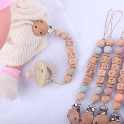 China Free Shape Baby Strawberry Chain Nipple Clip Silicone Nipple Clip Wooden BPA Beech Beaded Nipple Chain for sale