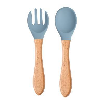 China Sustainable Food Grade Wooden Silicone Baby Feeding Training Spoon for sale