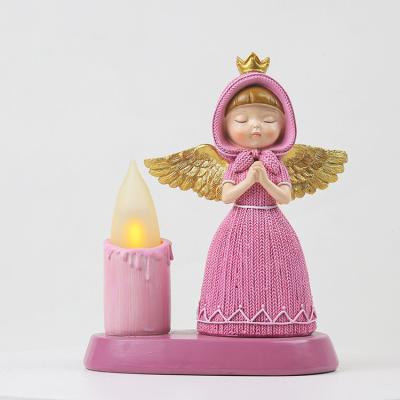 China Europe Product Best Selling Flameless Angel Resin Statue Golden Wings Angel Figurine With LED Candle for sale