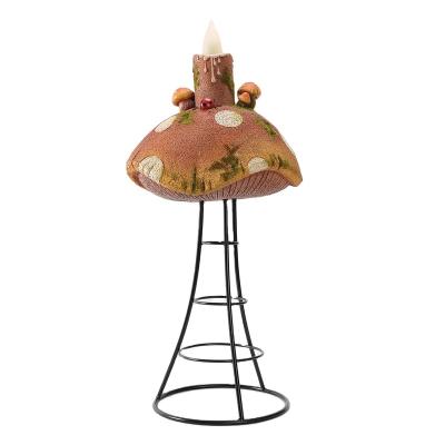 China Contemporary Home Polyresin Iron Stand Tall Abstract Red Mushroom Decoration With Flameless LED Candle Light for sale