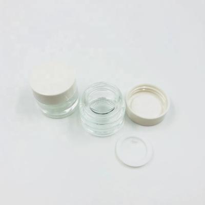 China Skin care mini 5g 10g 15g clear glass cream jar with white plastic cap/empty eye cream packaging/round glitter powder container for sale