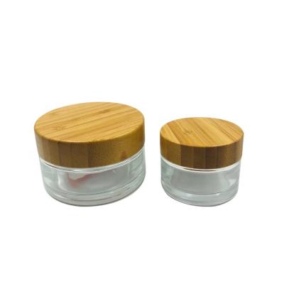 China High Grade 5/15/50/100g Skin Care Cream Clear Empty Round Glass Cream Jar With Bamboo Cap Bamboo Cosmetic Cream Jar/Cream Packing Container for sale