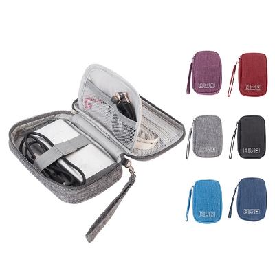 China Mini Waterproof Multifunctional Digital Electronic Bag Data Cable Storage Bag Hand Holding Mobile Power Earphone Storage Bag for sale