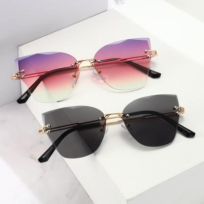 China Fashion Sunglasses 2021 New Trendy Cat Eye Frameless Cut Edge Gradient Color Sunglasses For Women for sale