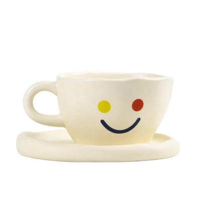 China INS Smile Face Mug Matte Stoneware Irregular Cream Color Smile Face Milk Ceramic Cup Breakfast Snack Dish Viable for sale