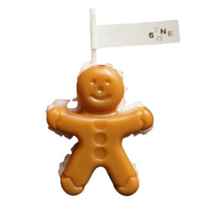 China Beautiful Gingerbread Man Shape Smokeless Cream Filled Photography Props Fragrance Decoration Christmas Scented Candle for sale