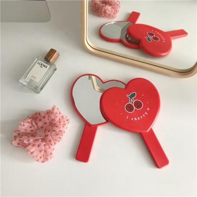 China Mirror Korea Central Statistical Institute of Korea Red Color Retro Cute Hanging Cute Logo Print Customize OEM Cherry Handle Cartoon Makeup Mirror for sale