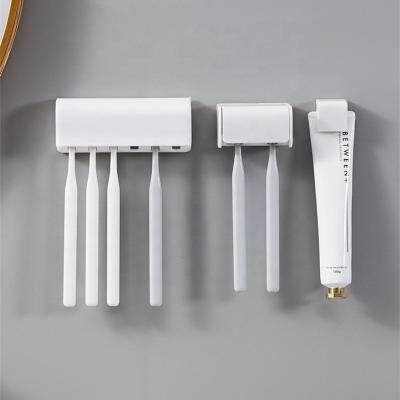 China Viable Wholesale Wall Mounted Plastic Toothpaste Dispenser ABS Detergent Toothbrush Facial Toothbrush Holder for sale