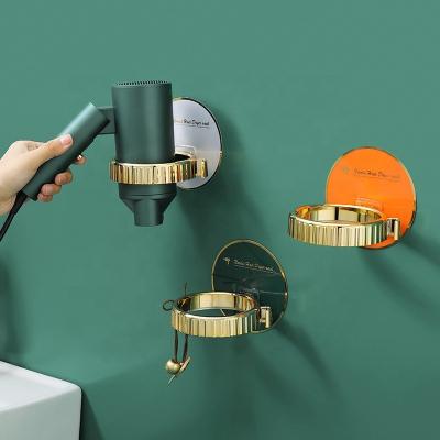 China Viable Nordic Style Plating Gold Color Bathroom Sink Hair Dryer Bracket Holder Rack Wall Mounted Storage Racks for sale