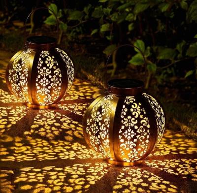 China Solar Hanging Outdoor Waterproof Garden LED Lantern Pendant Light Cavity Wrought Iron Lamp Solar Motion Lights Garden Art Decor for sale