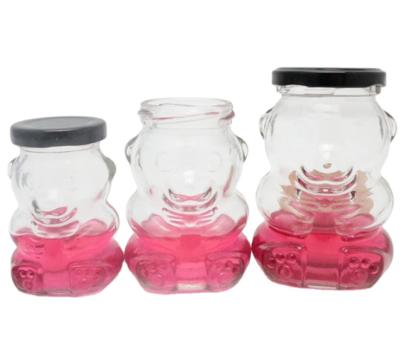 China Empty 270ml 9oz teddy bear shape glass jar with black metal plastisol airtight lid for sale