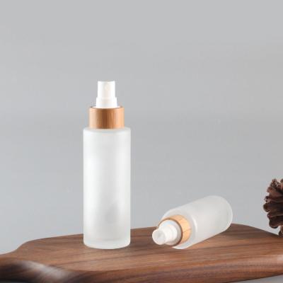 China Empty Perfume 50ml Glass Bottle Essential Oil Dropper Cosmetic Bamboo Cap Lid Cosmetic Glass Bottle With Mist Sprayer for sale