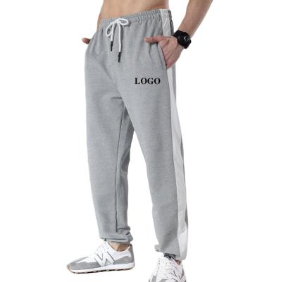 China Viable Custom Wholesale White Customized Logo Printed Embroidery Design Men Sporty Long Pants Embossed Sweatpants for sale