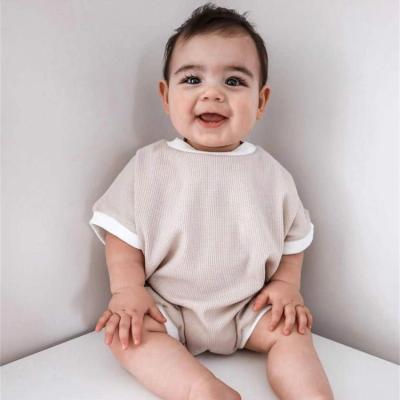 China Regular Style Short Sleeve Summer Waffle Cotton Drop Sheaths Baby Organic Cozy Bubble Sweatshirt White Cotton Trim Romper for sale