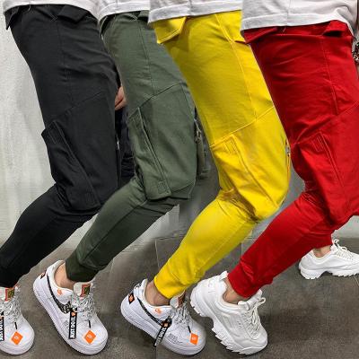 China Anti-wrinkle men's solid color multi-pocket hip-hop feet pants with rope sports pants thin casual pants for sale