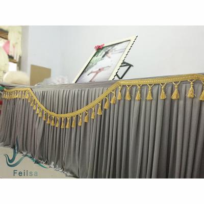 China Shiny Table Skirt With Tassel Decoration For Event Party Wedding Backdrop Curtain Stage Background for sale