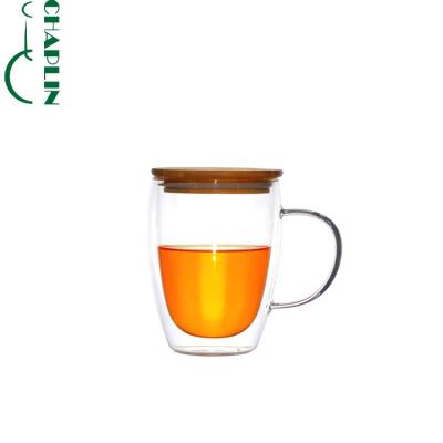 China Double Wall Sustainable Borosilicate Glass Coffee Mug With Bamboo Handle Cover for sale