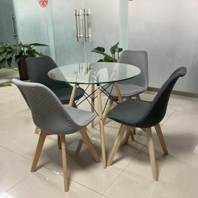 China Mid Century Round Home Furniture Clear Round Solid Wood Modern Tempered Glass Dining Table With Solid Wood Legs for sale