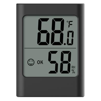 China Accurate Digital LCD Wall Hanging Smile Temperature Meter Hygrometer Time Thermometer Humidity Recorder 7.9*5.8*2.4cm for sale