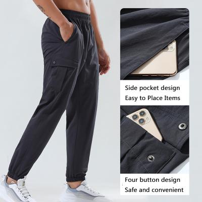 China Lulu Summer Ice Silk Men's Breathable Sports Quick Dry Pants Packing Pants Fitness Training Elastic Pocket Cargo Pants for sale