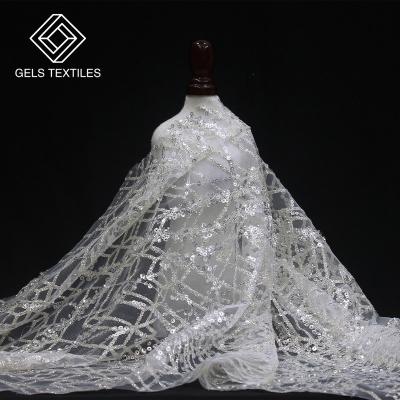 China 2022 New Breathable High Quality Korea White Lightning Sequins Lace Fabrics Tulle Beaded Nigerian Sequins For Wedding Party for sale