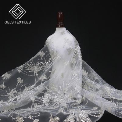 China New Breathable White Pearl Embroidered Wholesale White Beaded Tulle Spray Gold Sequin Textile Fabric For Dress Wedding for sale