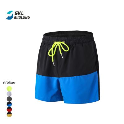 China Wholesales QUICK DRY Color Blocked Basketball Shorts Men Workout Polyester Spandex Shorts Gym Casual Quick Dry Shorts With Side Pockets for sale