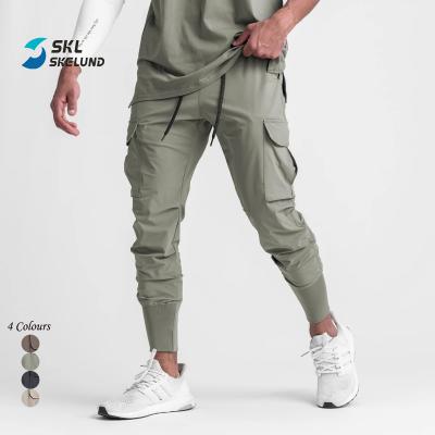 China Wholesale QUICK DRY Cargo Pants Men Jogger Pants Casual Sportswear Sweat Gym Stacked Joggers Pants With Side Pockets for sale