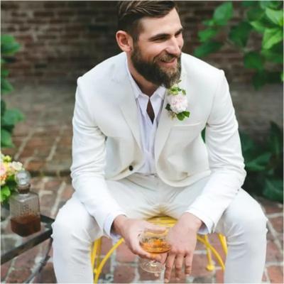 China 2022 Handsome Ivory Wedding Slim Fit Groom New Arrival Men Breathable Suits Peaked Lapel One Button Tuxedos Prom Party Blazer 2 Pcs Male for sale