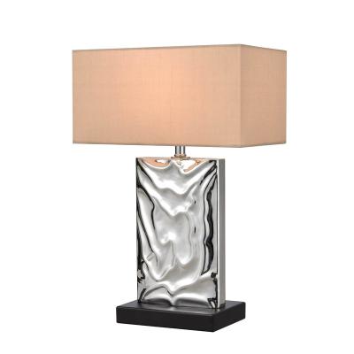 China Modern texture poly resin in polished silver finish table lamp for home console table and living room beside sofa for sale