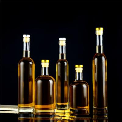 China 1000ml 750ml 500ml Glass Liquor Bottles Vodka Beverage Stored Bottle With Cork Top Lid for sale