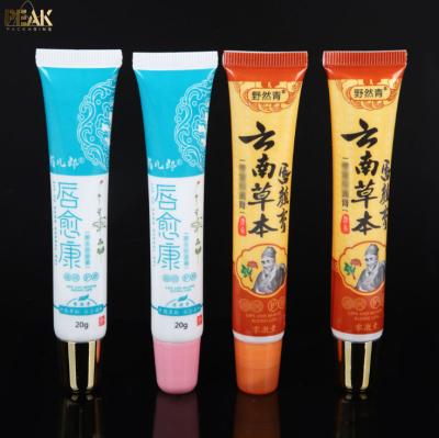 China Cosmetic Raw Plastic Lip Round Round Soft Tube Lip Balm Container for sale