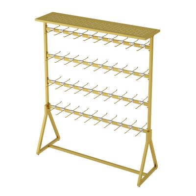 China Minimalist ornament rack display iron silk jars shelf underwear display rack showcase ornament floor multifunctional slipper rack for sale