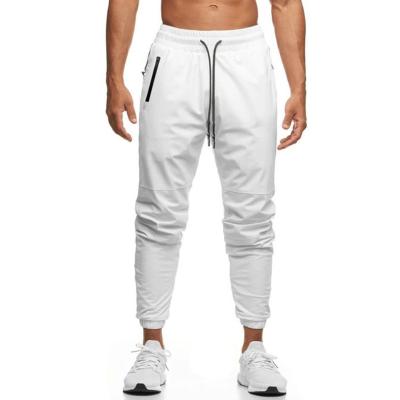 China Custom Made Anti-Wrinkle Men's Logo Woven Fitness Jogger Pants Drawstring Sports Tracksuit for sale