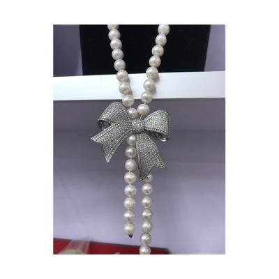 China Vintage 8mm AAA Grade Jewelry Round White Freshwater Pearl Women Bead Necklace With Silver Bowknot for sale