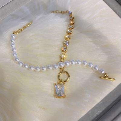 China Bling Runway 2021 Summer New Flash Diamond Pearl Necklace Geometric Stitching T-Shaped Pendant Necklace Buckle for sale