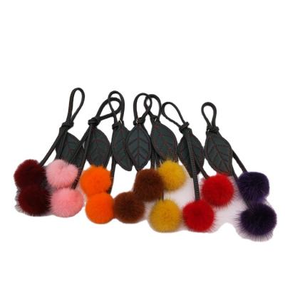 China Cute fluffy and smooth ladies cherry fruit fur ball bag fruit fur ball head chain furball pendant for sale