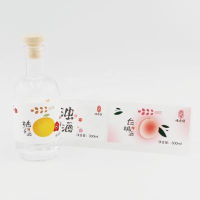 China Luxury Wine Bottle Label Sticker Waterproof Textured Paper Sticker for sale