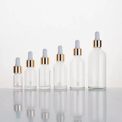 China Cosmetic 10ml 15ml 20ml 30ml 50ml 100ml china supply wholesale price empty serum transparent silver glass dropper bottle essential oil for sale