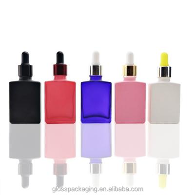 China Cosmetic 10ml 25ml 30ml produced wholesale manufacturer uv black amber yellow square golden essence oil glass dropper bottle for sale