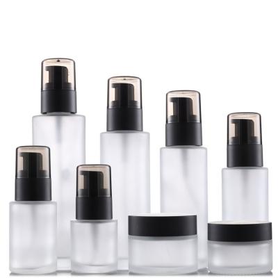 China Cosmetic 30ml50ml100ml dispensing spray liquid foundation press lotion bottle round shape flat shoulder frosted glass cream pump bottle for sale