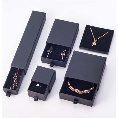 China Luxury Customized Design Recyclable Logo Printed Drawer Folding Plain Paper Black Cardboard Gift Box With Ribbon For Necklace Jewelry for sale